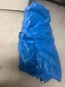 Tarp used to cover roof