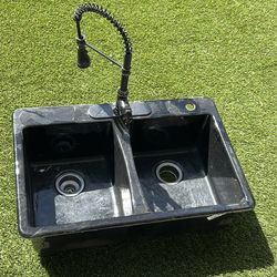 Used black cast-iron kitchen sink