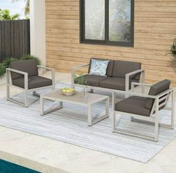 Outdoor patio couch with chairs and coffee table 