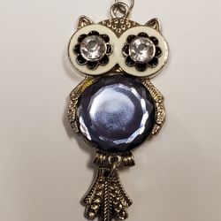Vintage Jointed Owl Pendant with One Large Blue And Two Clear Rhinestones.