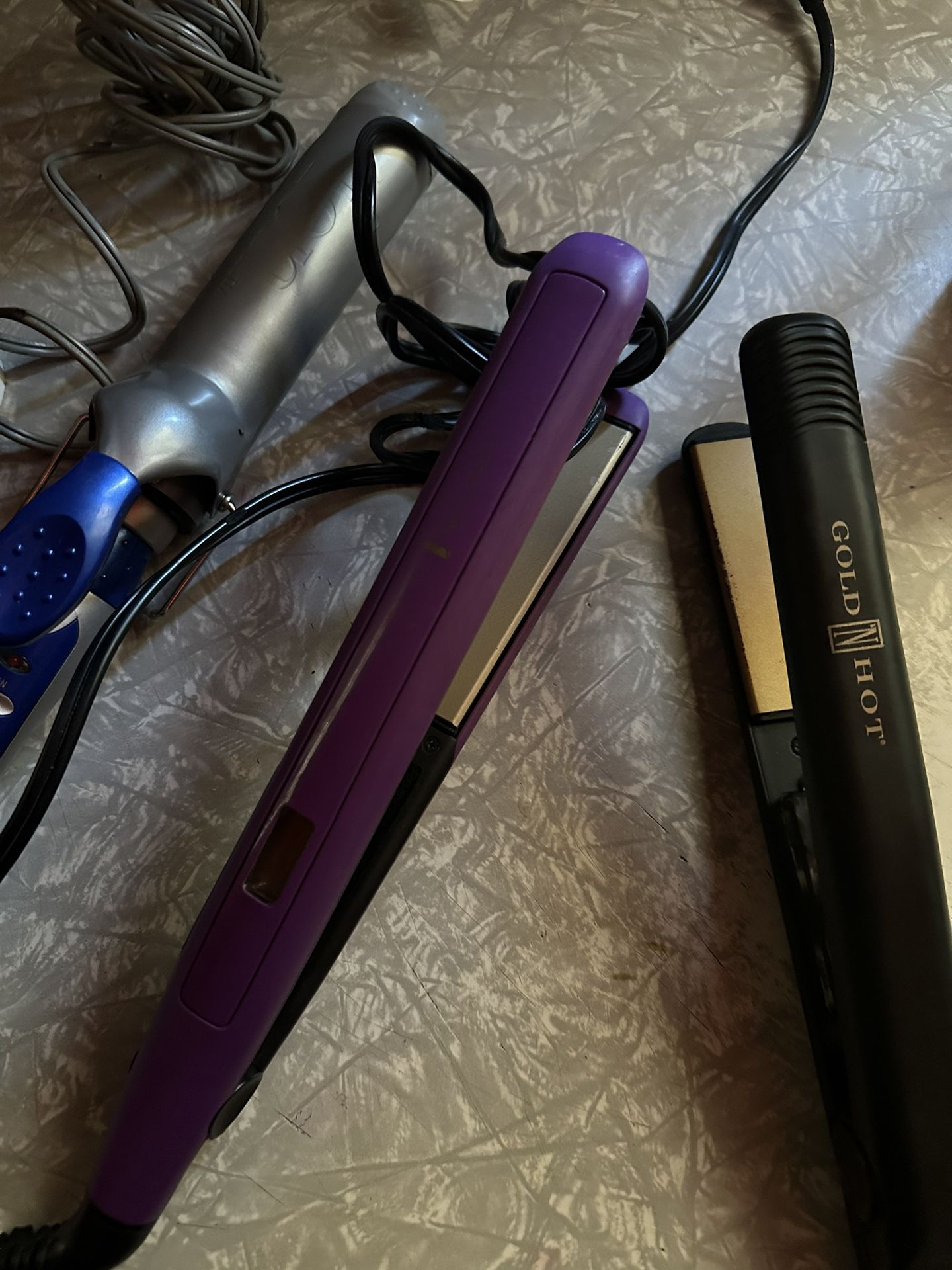 Two hair straighteners, and one curling iron. They all work great 15 for all or seven dollars each.