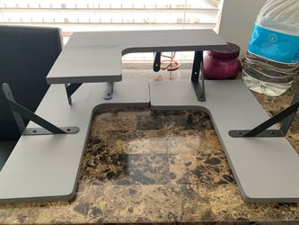 3 grey corner shelves