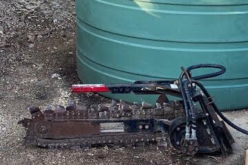 Mini skid steer trencher attachment