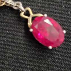 14 Karat diamond studded Ruby set in . 925 of silver pendant