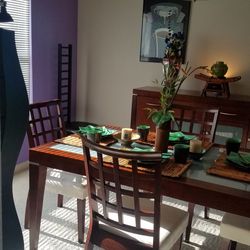 Table, Chairs, Server, China, Placemats, Flower Plant.