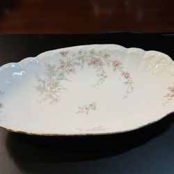 Antique Haviland Limoges porcelain oval serving platter with a pink floral pattern and gold gilt edge. 