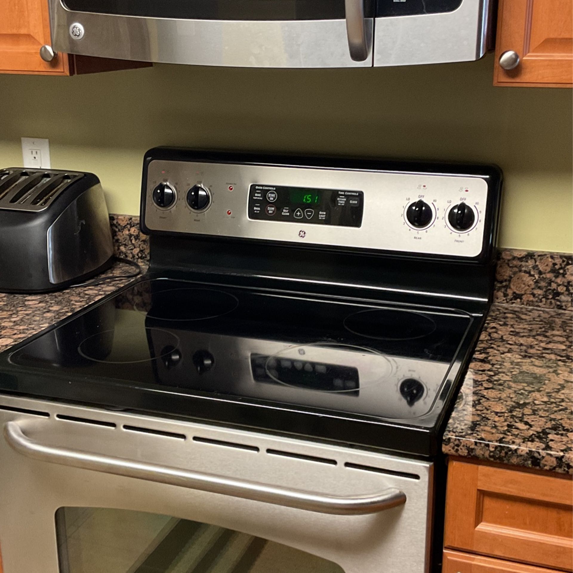 GE ELECTRIC STAINLESS STEEL RANGE AND MATCHING MICROWAVE FOR SALE