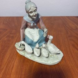 Porcelain Lady Feeding Ducks Figurine Vintage  6” Tall X 6” Wide Base X4” Deep