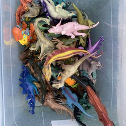 A large bucket of dinosaurs