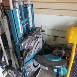 Makita 12-inch Dual-Bevel Sliding Compound Miter Charger And Battery. Saw With Rolling Stand.