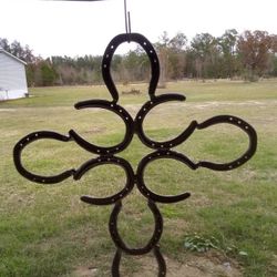 Cross Made Out Of Horse Shoes