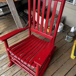 Red Adult Size Rocking chair. got a hole while moving easy fix with wood filler