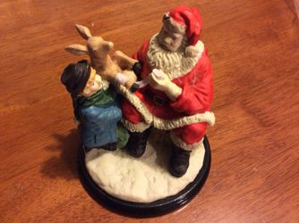 Santa helping hurt deer figurine on wood 5 tall