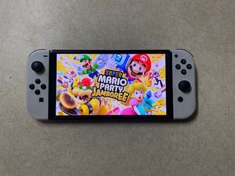 NINTENDO SWITCH OLED Loaded with 125 Switch Games
