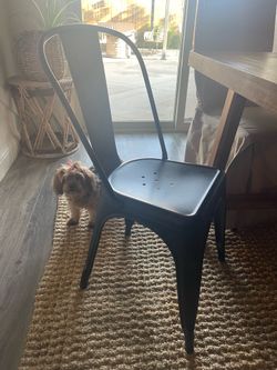 2 black metal chairs