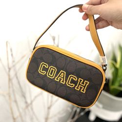 Coach Jamie Wristlet In Signature Canvas With Varsity Motif