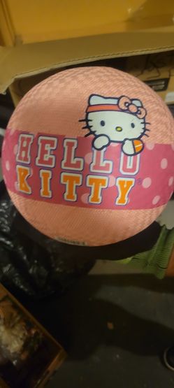 Hello Kitty sports or play ball, specifically a bouncy foam or playground ball. It features the character design with a pink background and the "Hello