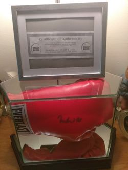 Authentic hand signed Muhammad Ali everlast boxing glove in mirrored display case has certificate of authenticity