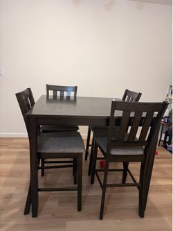 Bar height table and chairs