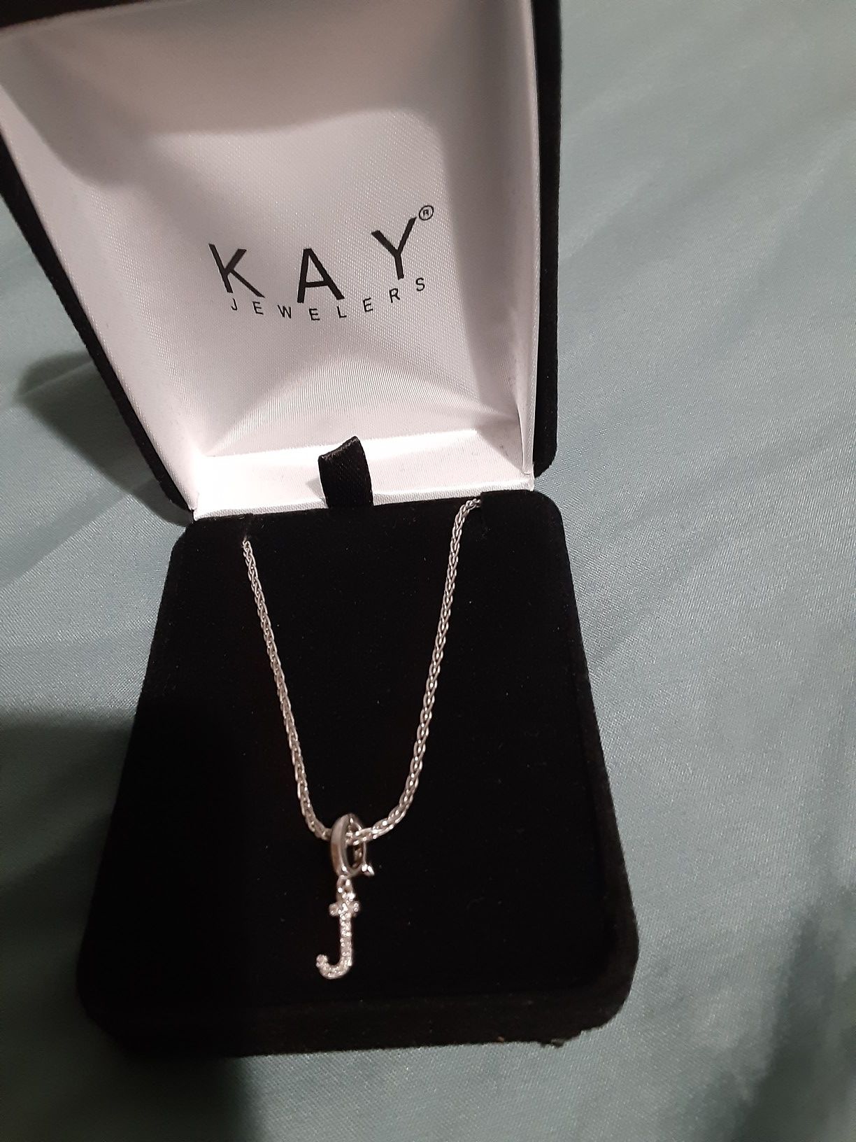 925 sterling silver from Kay Jewelers the diamonds and the J are real