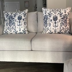 Two-seater couch with cushions