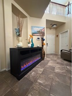 Beautiful espresso fireplace /tv stand with different colors of flames