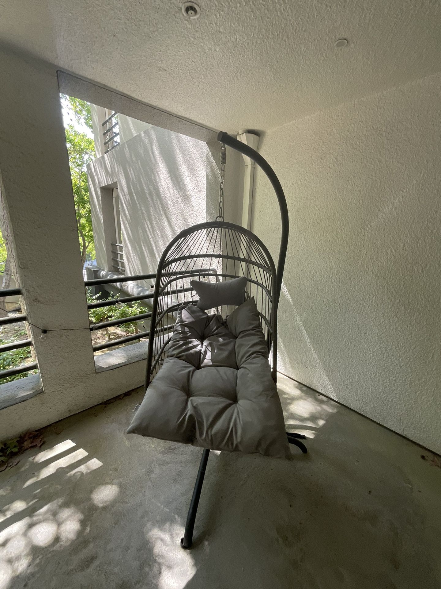 Egg Chair With A Plush Seat And Pillow