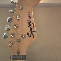 Squier Mini by Fender Electric Guitar, Epiphone Amp, guitar stand, guitar strap and all cords