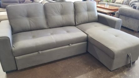 Grey sofa chaise with pullout bed