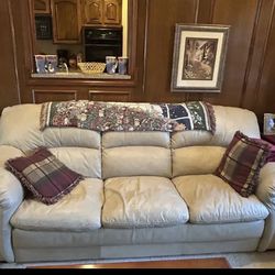 Two Matching Cream Leather Sofas