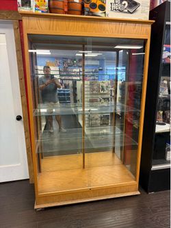 Vertical tall glass display case