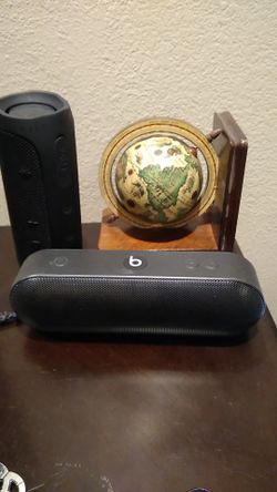 black Beats Pill + Bluetooth speaker