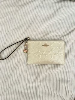 Coach Signature Embossed Wristlet