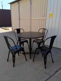 TABLE AND FOUR METAL CHAIRS