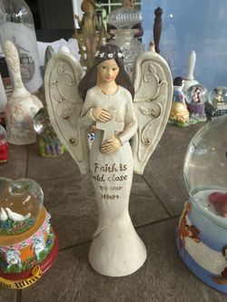 Angel Figurine Faith Is Held Close to Our Heart