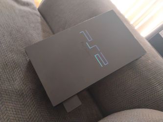 This is a PlayStation 2 works good and nice with games on the  side with a controller and all the cords