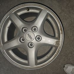 5-spoke aluminum alloy wheel, likely from a 1(contact info removed) Pontiac Firebird