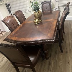 Dining table set! 8 chairs included with an extension