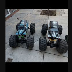 2 monster trucks/ And 4 sharks asking $10 each no remote my kids lost as is all working