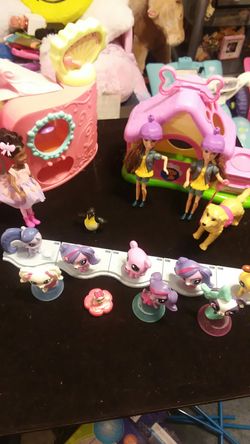 Littlest Pet Shop toys and three small dolls 2 shops