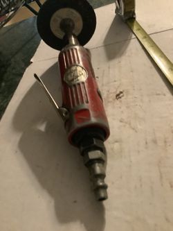pneumatic tool commonly used for grinding, polishing, or cutting metal.The device has a red casing with a metallic "AIR TOOL" label on the body. 1/4” 