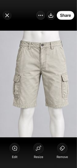 Levis Men’s Khaki cotton cargo shorts with side flap pockets, button fly, and belt loops. Classic relaxed fit with knee-length cut. Used, frayed . If 