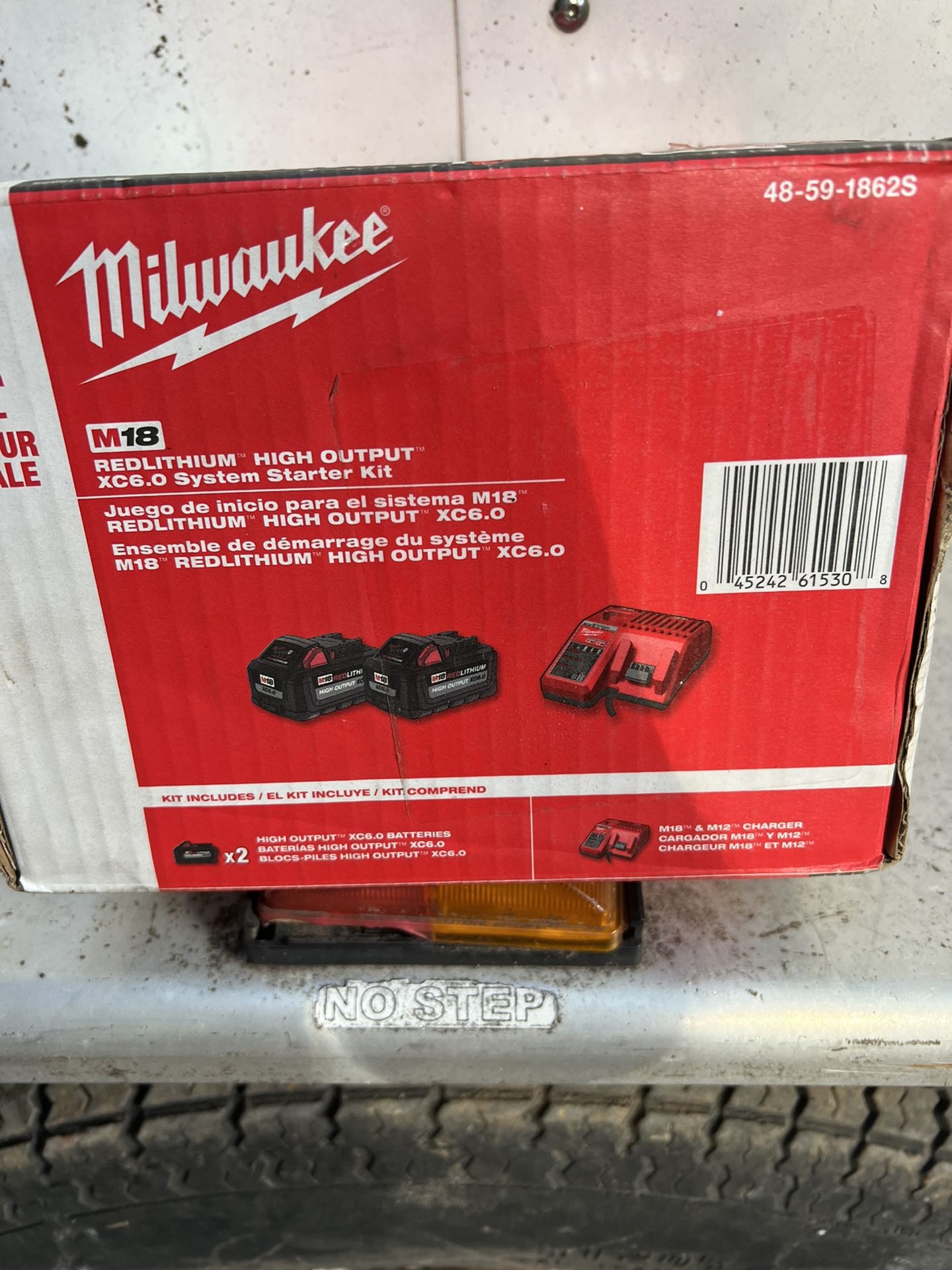 Milwaukee Charger And Two 6.0(m18)