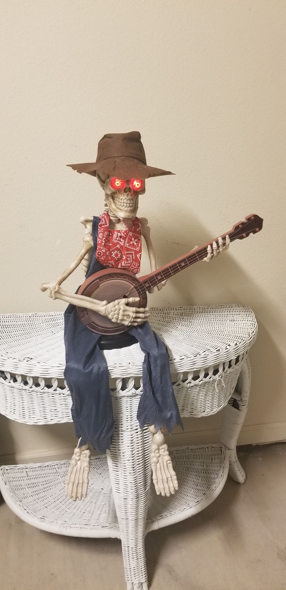 38 in. Animated Skeleton Playing Banjo with LED Illuminated Eyes. From Home Depot. HALLOWEEN DECOR