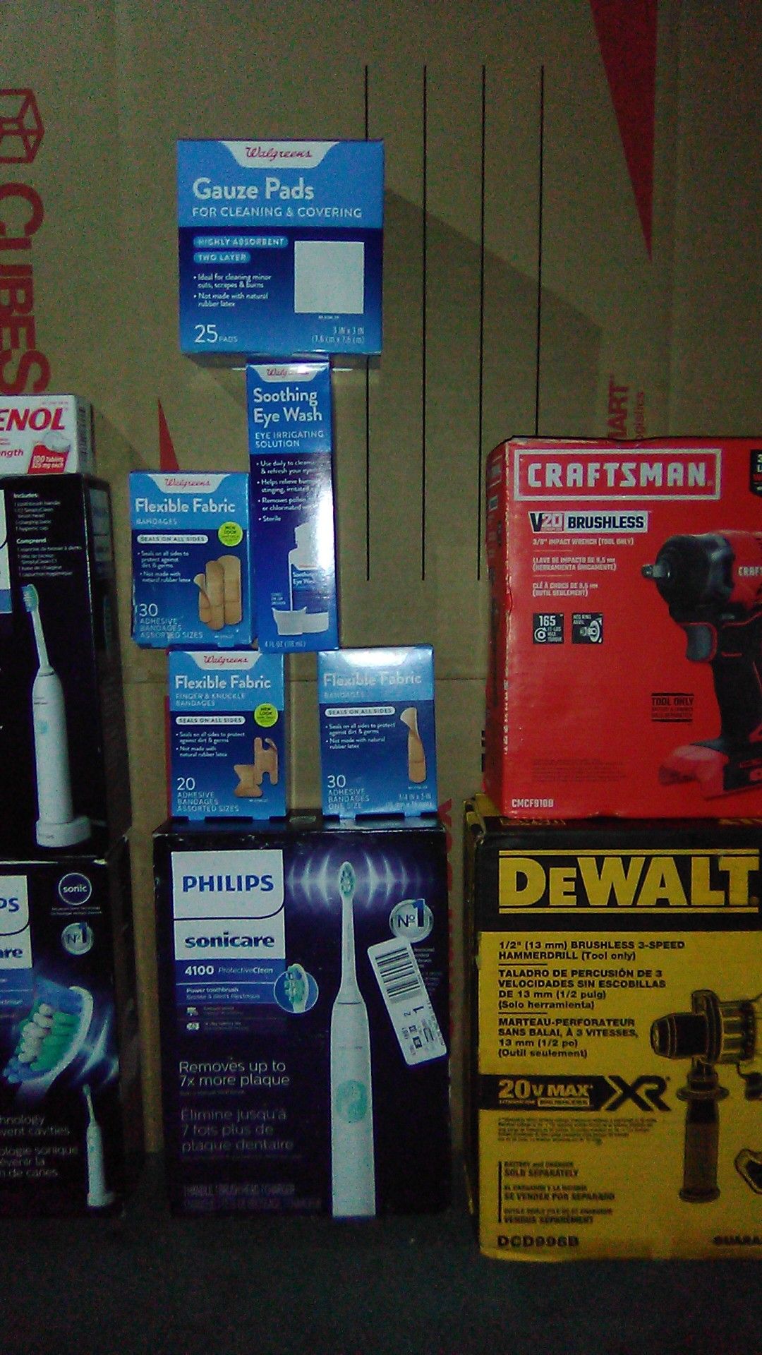 3/8 craftsman impact wrench, 1/2" DeWalt Hammer drill, 3 sonicare sets, boxes of Band-Aids and Tylenol