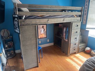 Bunk bed with desk and shelves and drawers underneath. Includes twin mattress!