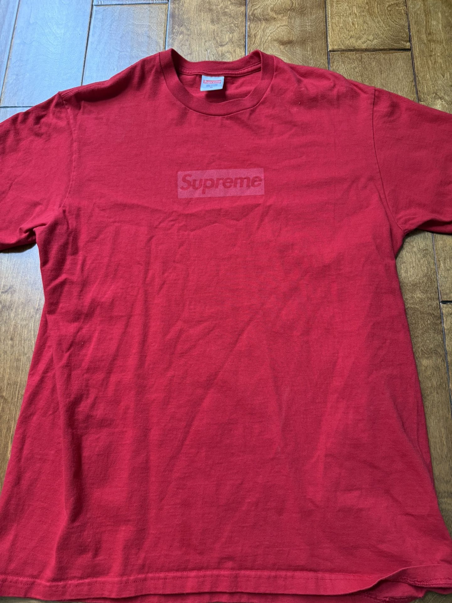 red supreme shirt