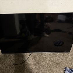 Phillips 57 inch flat TV with wall mount - $100