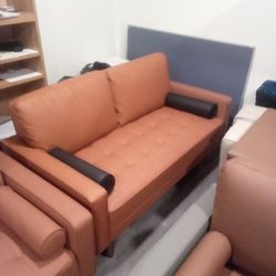 Tangerine Orange Leather Couch Black Pillow