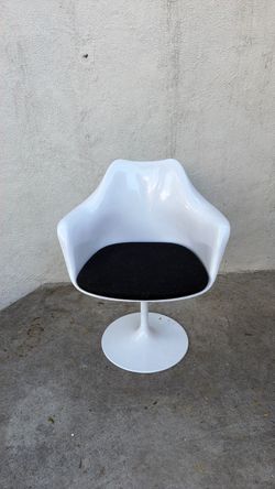 Black-and-white mid-century, modern spinning lounge chair